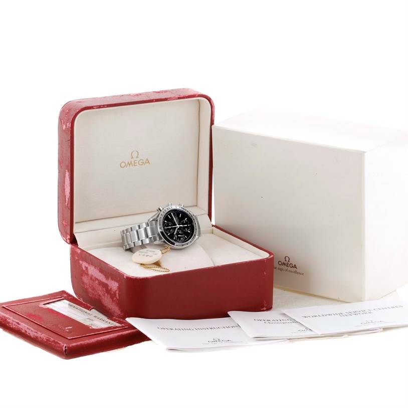 The Omega Speedmaster 3513.50.00 Men
s Stainless Steel Black Dial 3513.50.00 Men
s Stainless Steel Black Dial watch is shown in its open red box with paperwork and a white outer box beside it.