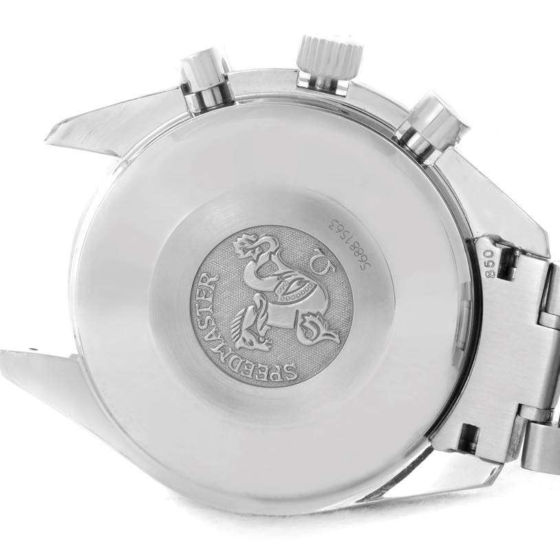 The image shows the backside and crown of the Omega Speedmaster 3513.50.00 Men
s Stainless Steel Black Dial 3513.50.00 Men
s Stainless Steel Black Dial watch, highlighting the engraved back case.