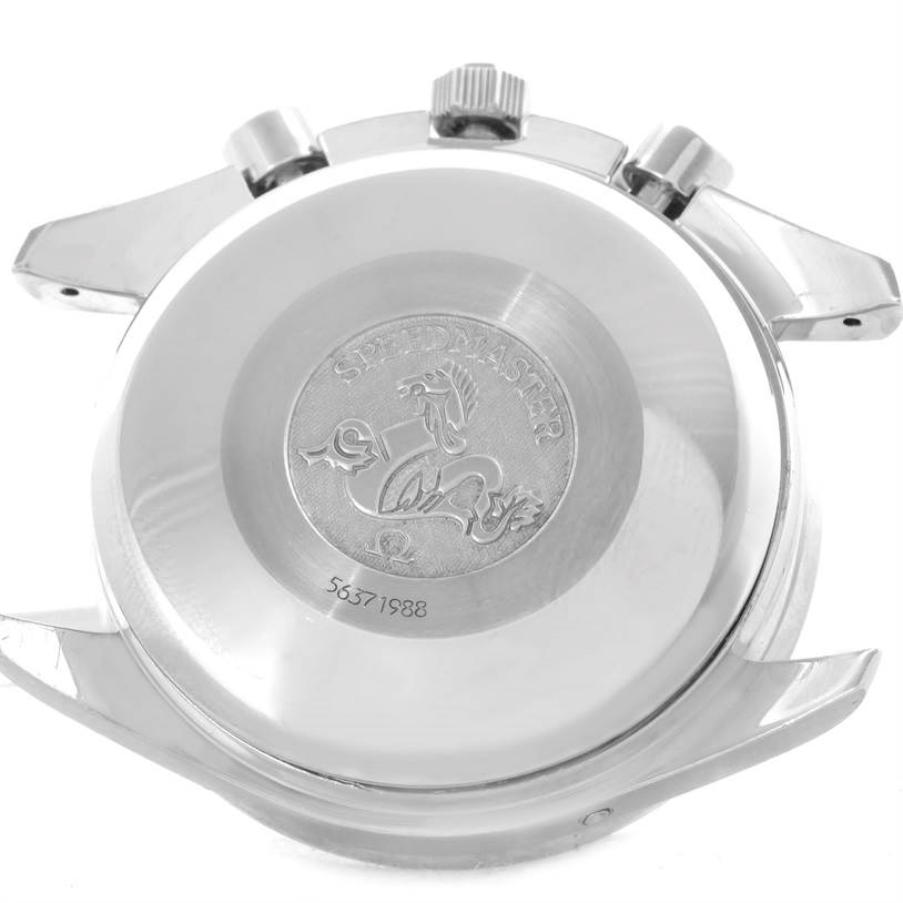 The image shows the back case and crown of an Omega Speedmaster 3523.80.00 Men
s Stainless Steel Blue Dial 3523.80.00 Men
s Stainless Steel Blue Dial watch, highlighting the engraved logo and model details.