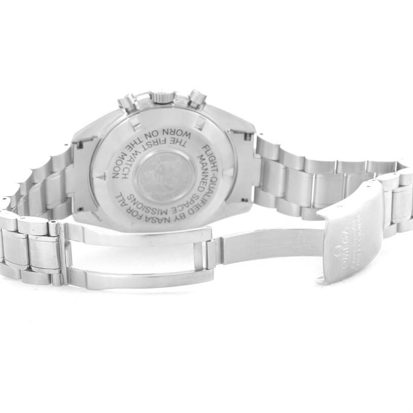 The image shows the back case and partially opened metal clasp of an Omega Speedmaster Men
s Stainless Steel Black Dial Men
s Stainless Steel Black Dial watch.