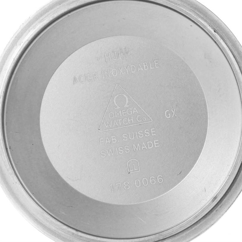 The image shows the inner case back of an Omega Speedmaster 323.30.40.40.06.001 Men
s Stainless Steel Black Dial 323.30.40.40.06.001 Men
s Stainless Steel Black Dial watch with engravings detailing its specifications.