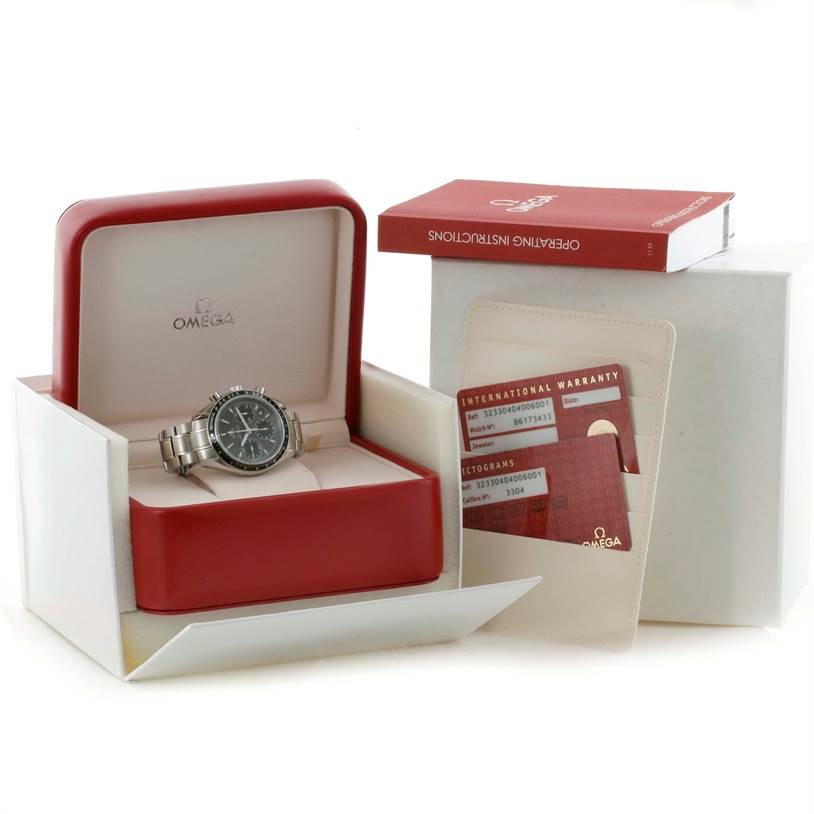 The Omega Speedmaster 323.30.40.40.06.001 Men
s Stainless Steel Black Dial 323.30.40.40.06.001 Men
s Stainless Steel Black Dial watch is shown front-facing in its open box, accompanied by warranty cards and an instruction booklet.