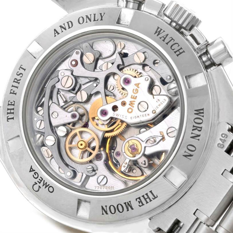 The image shows the open caseback of the Omega Speedmaster 3573.50.00 Men
s Stainless Steel Black Dial 3573.50.00 Men
s Stainless Steel Black Dial, revealing the intricate movement and internal mechanisms.