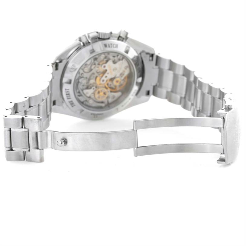 This image shows the back view of an Omega Speedmaster 3573.50.00 Men
s Stainless Steel Black Dial 3573.50.00 Men
s Stainless Steel Black Dial watch, highlighting its open case back and metal bracelet.