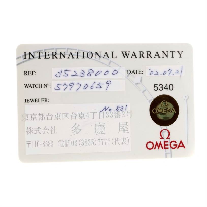 An Omega Speedmaster 3523.80.00 Men
s Stainless Steel Blue Dial 3523.80.00 Men
s Stainless Steel Blue Dial International Warranty card is shown from the front, detailing reference and serial numbers, date, and jeweler info.