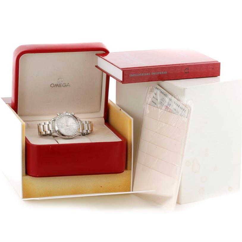 The Omega Speedmaster 3523.30.00 Men
s Stainless Steel Silver Dial 3523.30.00 Men
s Stainless Steel Silver Dial watch is displayed in its open box, accompanied by an instruction booklet and warranty card.