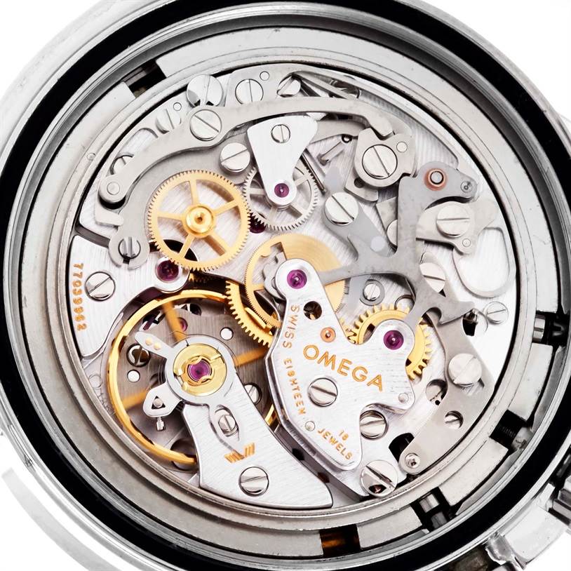 The image shows the inner mechanical movement of an Omega Speedmaster 3570.50.00 Men
s Stainless Steel Black Dial 3570.50.00 Men
s Stainless Steel Black Dial watch, highlighting the gears and intricate components.
