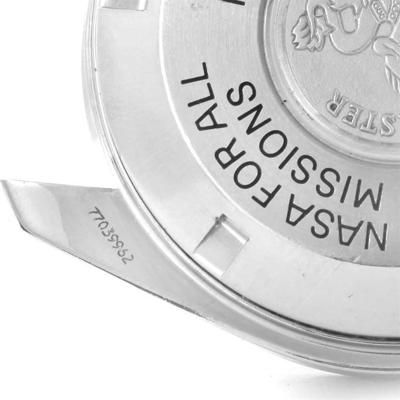 The image shows a close-up of the case back of an Omega Speedmaster 3570.50.00 Men
s Stainless Steel Black Dial 3570.50.00 Men
s Stainless Steel Black Dial, highlighting the engraved text and emblem.