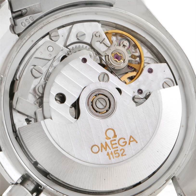 The image shows the Omega Speedmaster 3513.30.00 Men
s Stainless Steel Silver Dial 3513.30.00 Men
s Stainless Steel Silver Dial
s open case back, revealing its automatic movement with "Omega 1152" markings.
