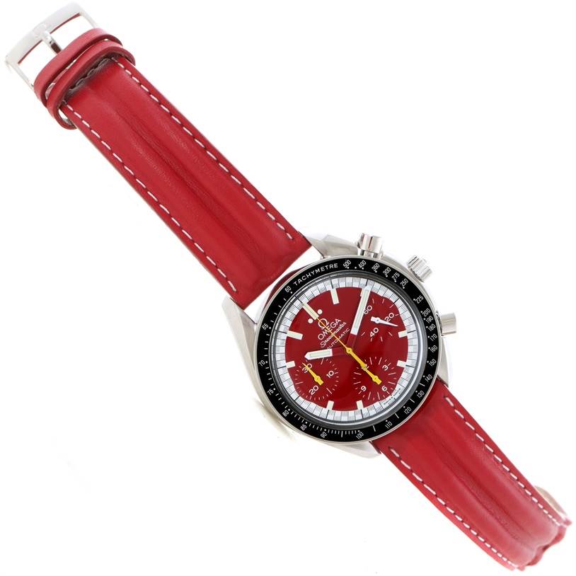 The Omega Speedmaster 3510.61.00 Men's Stainless Steel Red Dial 3510.61.00 Men's Stainless Steel Red Dial is shown diagonally, featuring a red leather strap, red dial, chronograph sub-dials, and a tachymeter bezel.