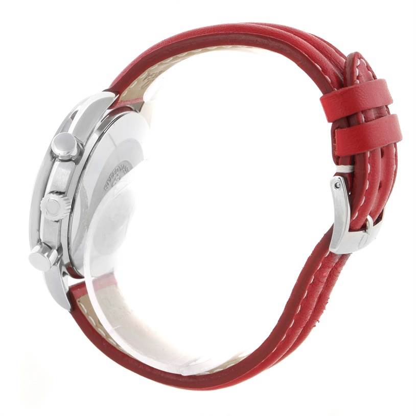 The image shows a side view of an Omega Speedmaster 3510.61.00 Men's Stainless Steel Red Dial 3510.61.00 Men's Stainless Steel Red Dial watch, highlighting its case, pushers, and red leather strap.