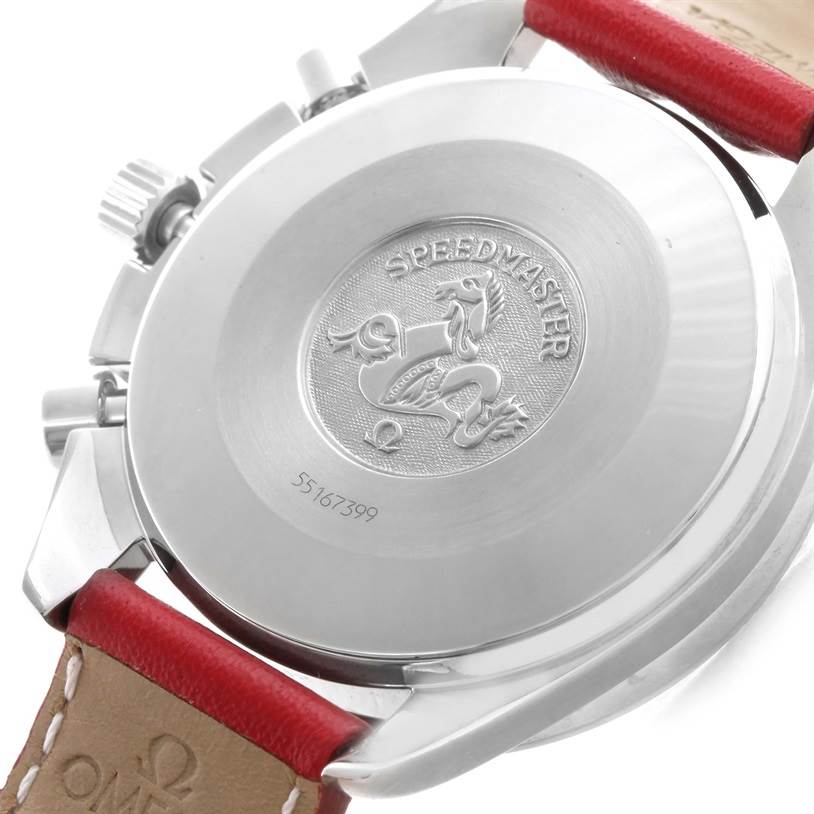 The image shows the backside of an Omega Speedmaster 3510.61.00 Men's Stainless Steel Red Dial 3510.61.00 Men's Stainless Steel Red Dial watch, featuring the engraving and serial number.