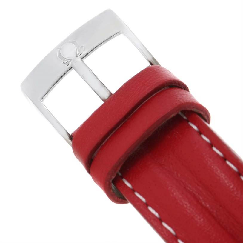 The image shows a close-up of the red leather strap and silver buckle of an Omega Speedmaster 3510.61.00 Men's Stainless Steel Red Dial 3510.61.00 Men's Stainless Steel Red Dial watch.