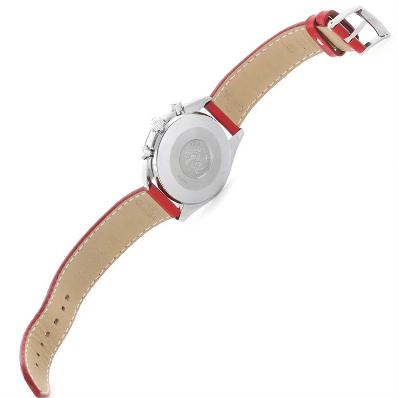 The image shows the back view of an Omega Speedmaster 3510.61.00 Men's Stainless Steel Red Dial 3510.61.00 Men's Stainless Steel Red Dial watch, featuring the case back and the red leather strap.