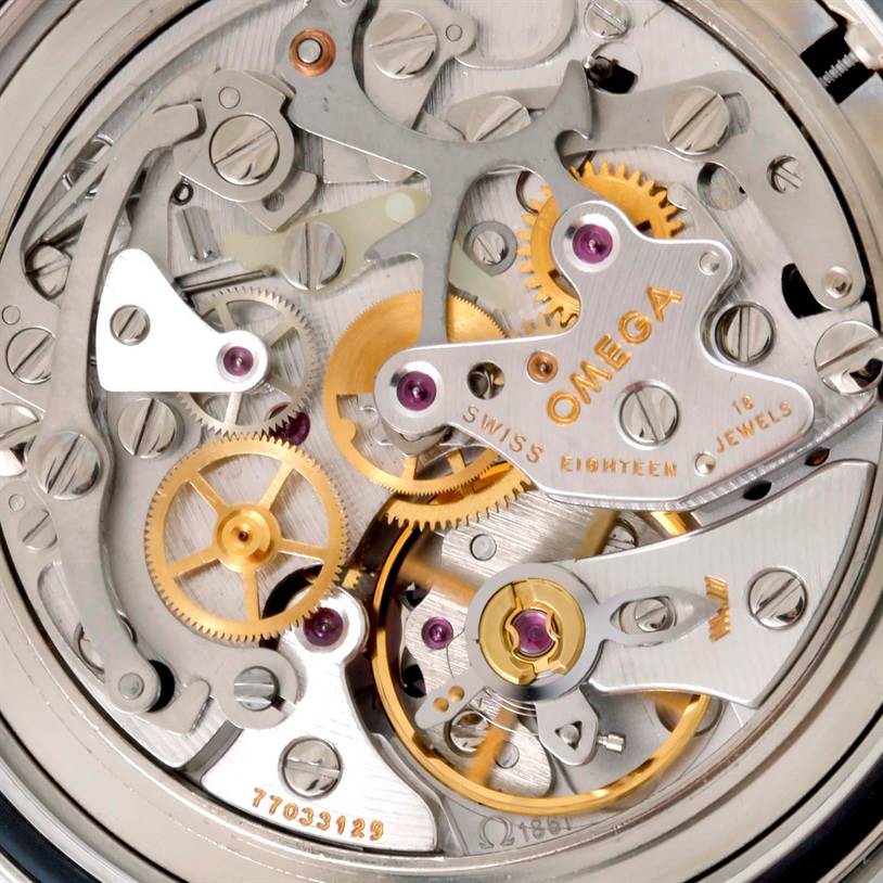 The image shows a close-up view of the Omega Speedmaster 3570.50.00 Men
s Stainless Steel Black Dial 3570.50.00 Men
s Stainless Steel Black Dial watch movement, highlighting its intricate gears and components.