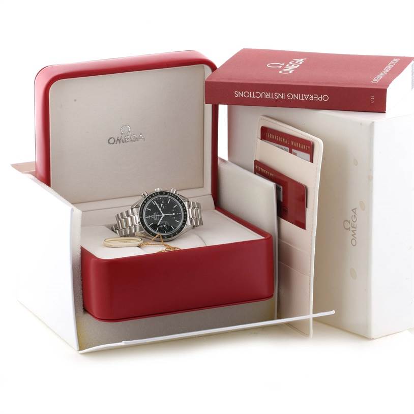 The Omega Speedmaster 3539.50.00 Men
s Stainless Steel Black Dial 3539.50.00 Men
s Stainless Steel Black Dial watch is displayed head-on inside its open box, with the operating instructions and warranty card visible.