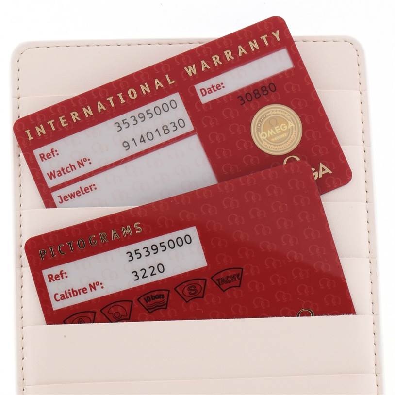 The image shows the warranty and pictogram cards for an Omega Speedmaster 3539.50.00 Men
s Stainless Steel Black Dial 3539.50.00 Men
s Stainless Steel Black Dial watch.