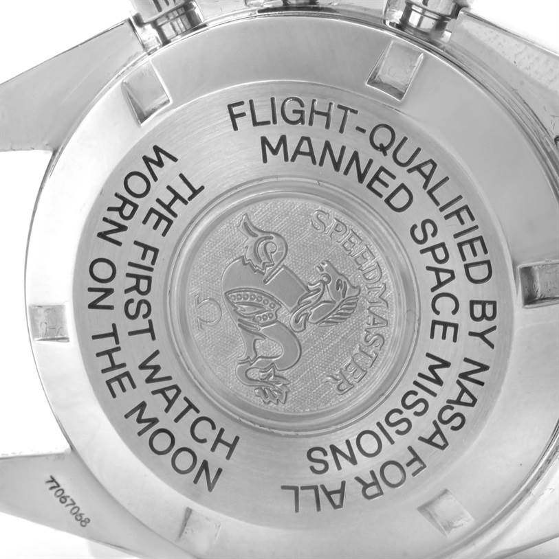 The image shows the back case of the Omega Speedmaster 3575.20.00 Men
s Stainless Steel White Dial 3575.20.00 Men
s Stainless Steel White Dial watch, highlighting the engraved text and emblem.