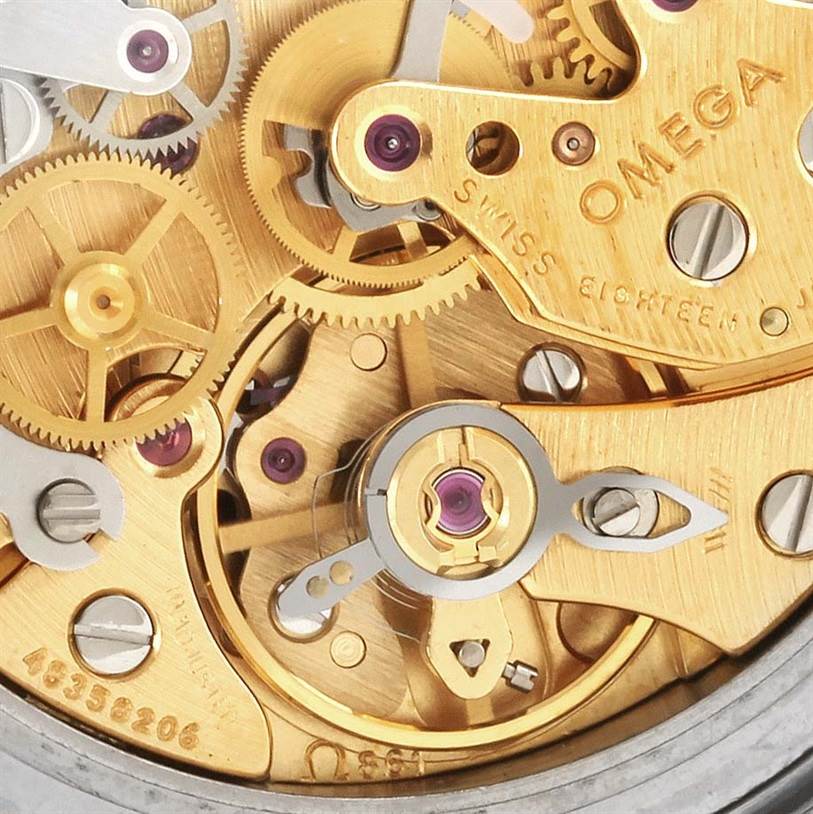 This image shows a close-up view of the intricate inner mechanics of the Omega Speedmaster Men
s Stainless Steel Black Dial Men
s Stainless Steel Black Dial watch movement.