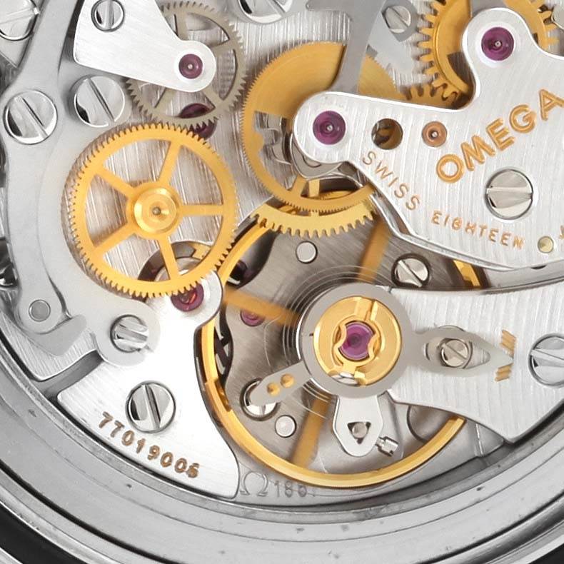 This close-up image shows the intricate internal mechanism of the Omega Speedmaster 3570.50.00 Men
s Stainless Steel Black Dial 3570.50.00 Men
s Stainless Steel Black Dial watch, emphasizing its gears and components.