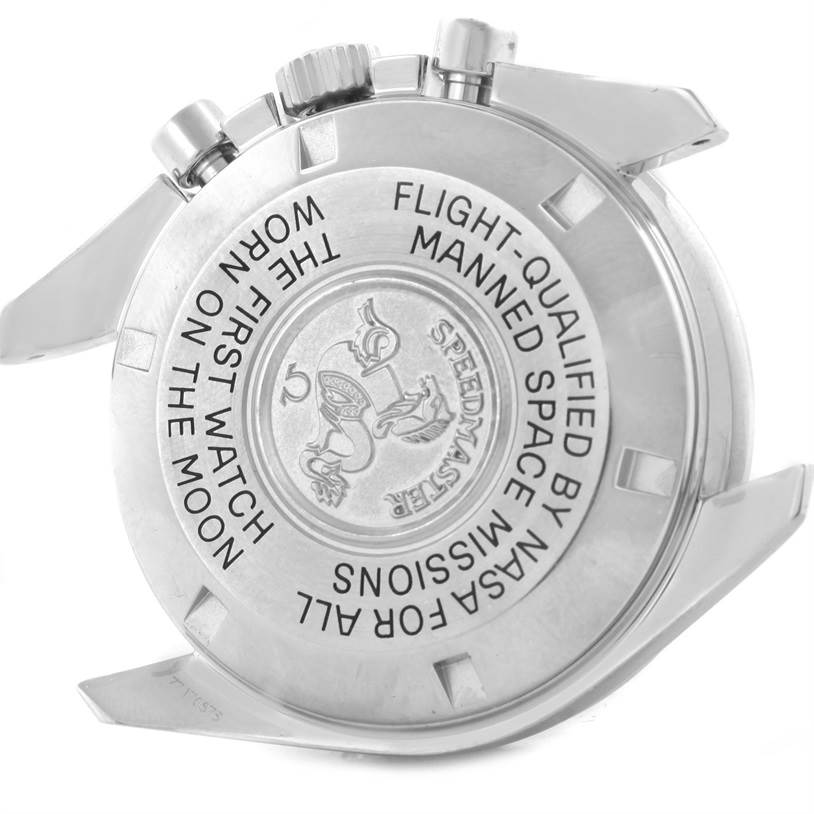 The image shows the back case and crown of an Omega Speedmaster 3570.50.00 Men
s Stainless Steel Black Dial 3570.50.00 Men
s Stainless Steel Black Dial watch, highlighting its engraved inscription.