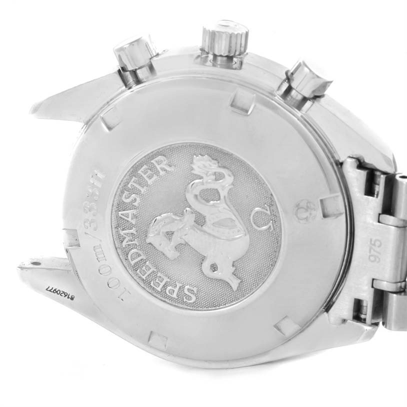 The image shows the back case and some side buttons of an Omega Speedmaster 3222.80.00 Men
s Stainless Steel Blue Dial 3222.80.00 Men
s Stainless Steel Blue Dial watch from a slightly angled perspective.