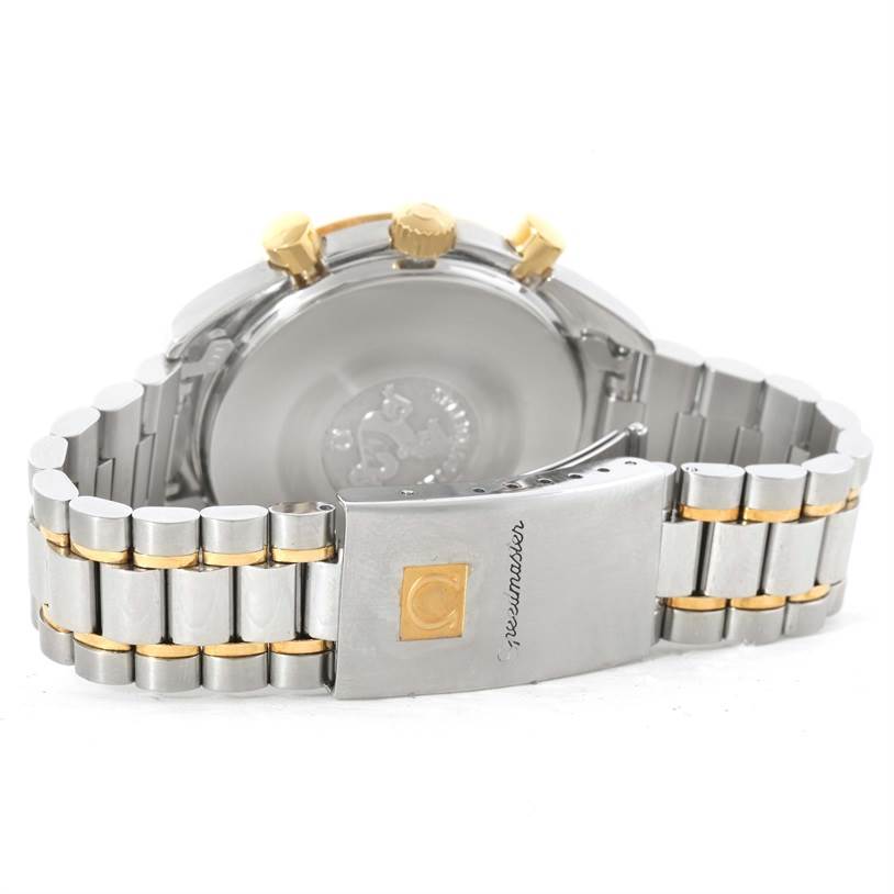 The image shows the back view of an Omega Speedmaster 3310.10 Men's Steel and Gold (two tone) Champagne Dial 3310.10 Men's Steel and Gold (two tone) Champagne Dial, featuring the clasp, bracelet, crown, and case back.