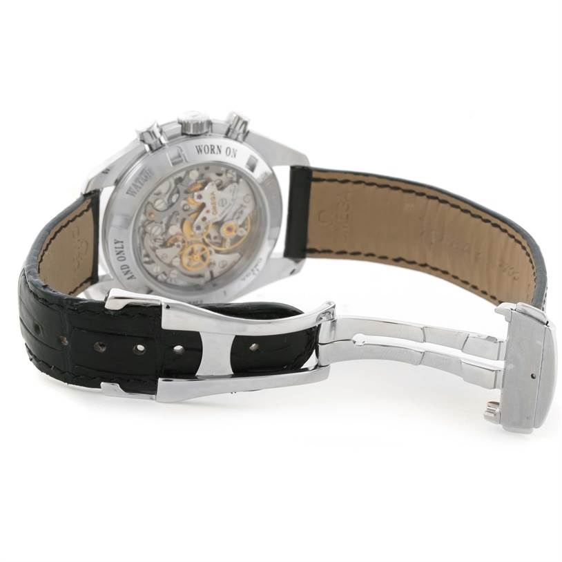 The image shows the backside of an Omega Speedmaster 3876.50.31 Stainless Steel Black Dial 3876.50.31 Stainless Steel Black Dial watch, highlighting its transparent case back and black leather strap with a deployment clasp.