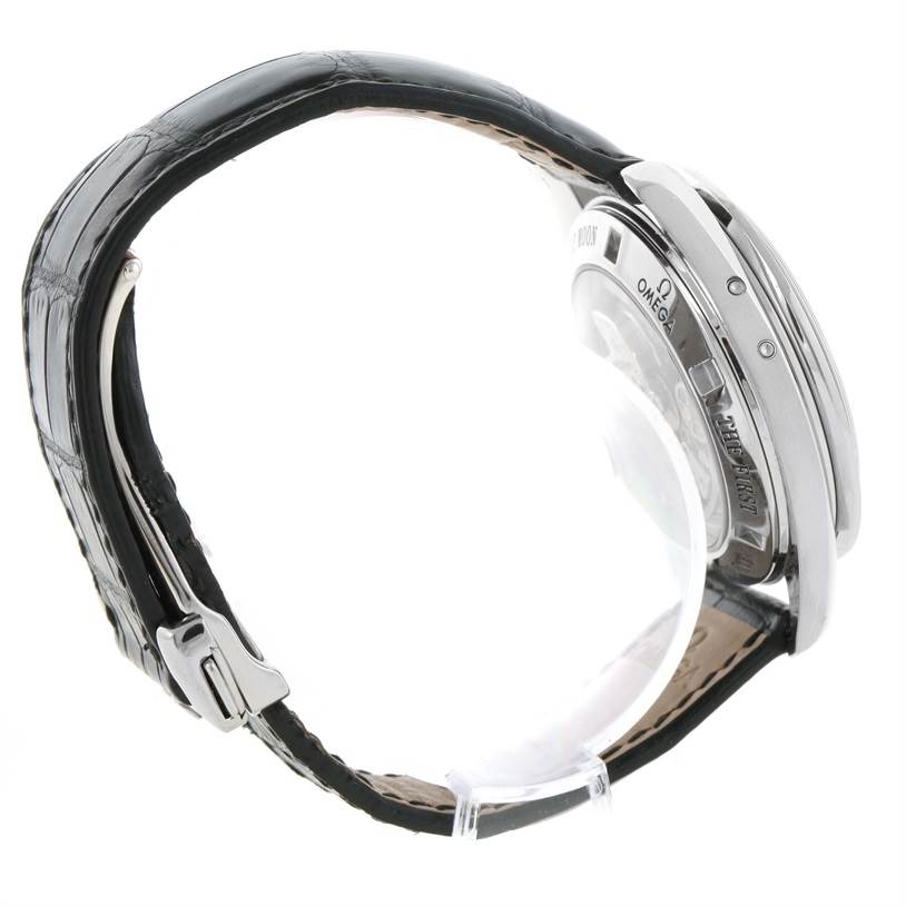 The image shows a side view of an Omega Speedmaster 3876.50.31 Stainless Steel Black Dial 3876.50.31 Stainless Steel Black Dial watch, featuring its leather strap, clasp, and case back.