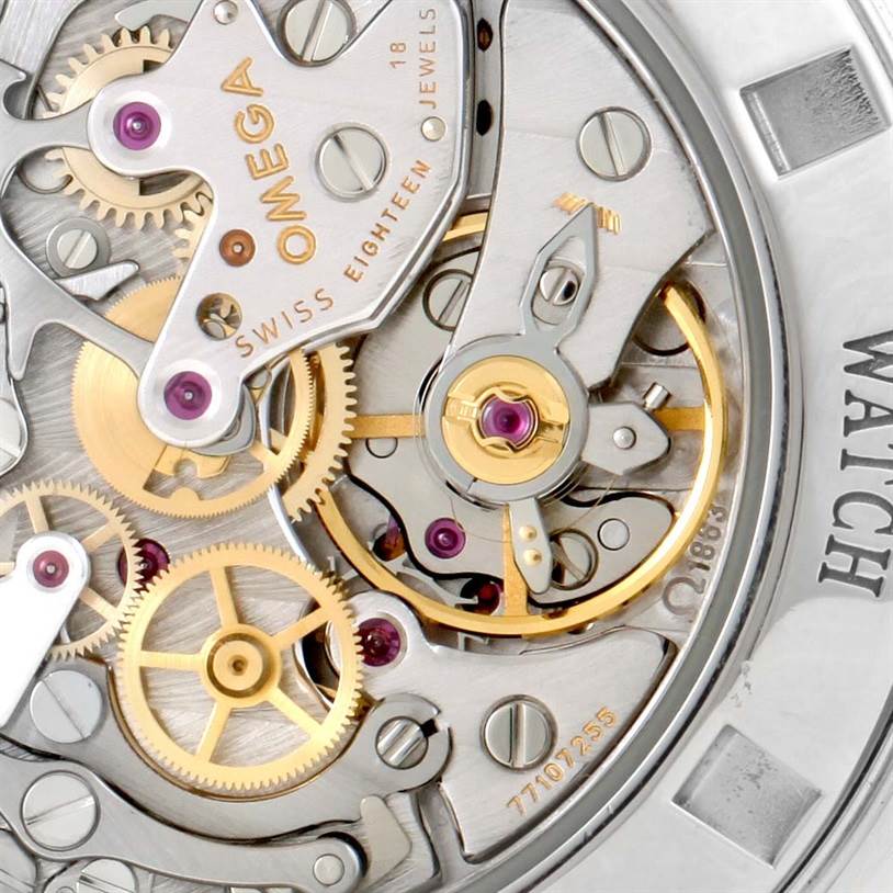 The image shows an angled close-up of the intricate movement and inner workings of the Omega Speedmaster 3573.50.00 Men
s Stainless Steel Black Dial 3573.50.00 Men
s Stainless Steel Black Dial watch.