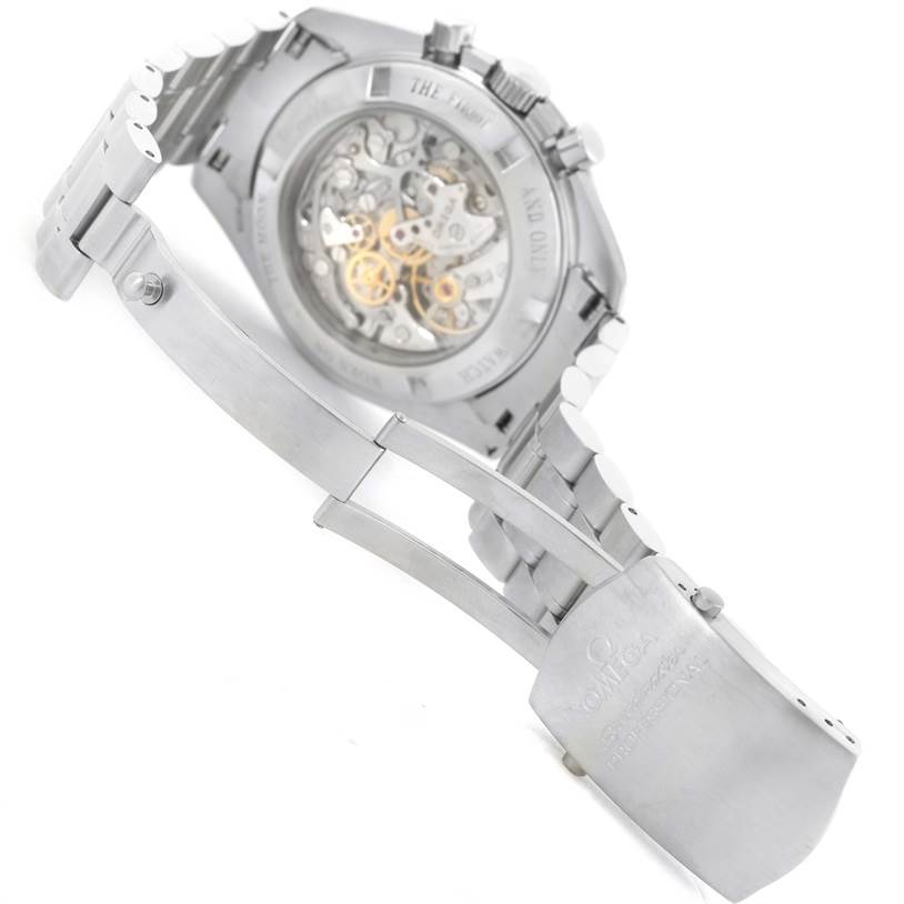 The image shows the back of the Omega Speedmaster 3573.50.00 Men
s Stainless Steel Black Dial 3573.50.00 Men
s Stainless Steel Black Dial watch, highlighting the see-through case back and metal bracelet.