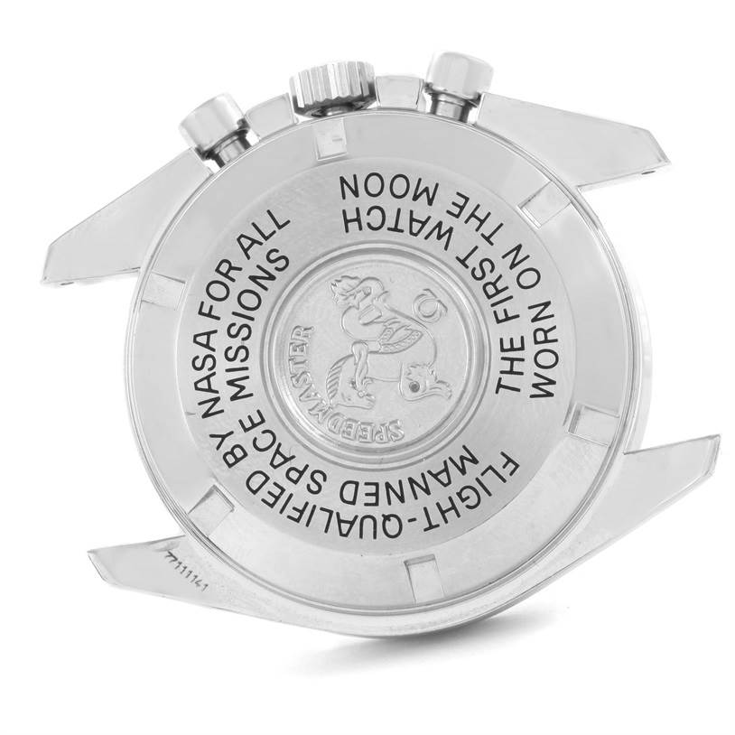 The image shows the case back of an Omega Speedmaster 3570.50.00 Men
s Stainless Steel Black Dial 3570.50.00 Men
s Stainless Steel Black Dial watch with engraved text and the emblem.