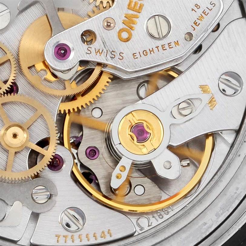 This image shows a close-up view of the Omega Speedmaster 3570.50.00 Men
s Stainless Steel Black Dial 3570.50.00 Men
s Stainless Steel Black Dial
s intricate inner watch mechanism, highlighting gears and jewels.