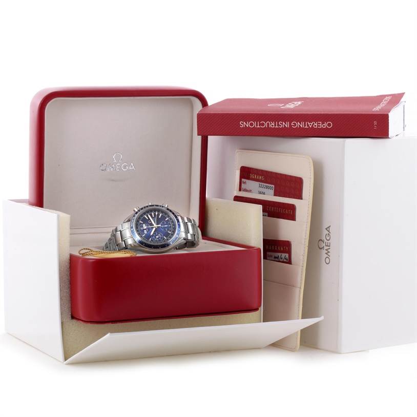 The image shows an Omega Speedmaster 3222.80.00 Men
s Stainless Steel Blue Dial 3222.80.00 Men
s Stainless Steel Blue Dial watch in its box with accompanying documents and an operating instructions manual.