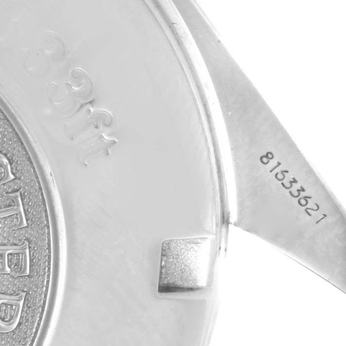 The image shows a close-up of the back case and part of the bracelet of an Omega Speedmaster 3222.80.00 Men
s Stainless Steel Blue Dial 3222.80.00 Men
s Stainless Steel Blue Dial watch.