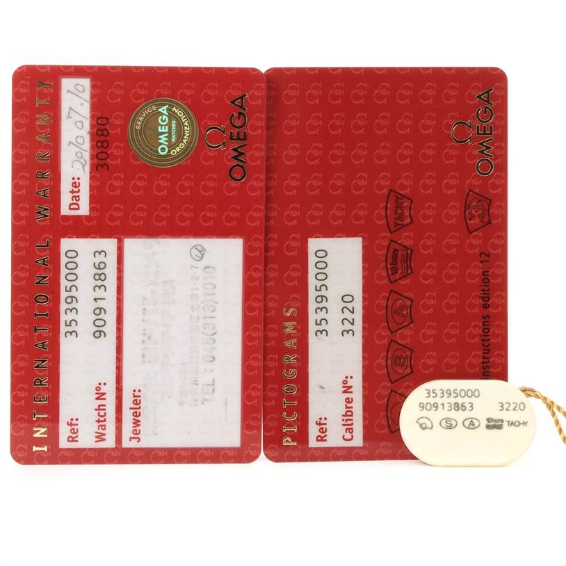 This image shows the international warranty and pictograms cards for an Omega Speedmaster 3539.50.00 Men
s Stainless Steel Black Dial 3539.50.00 Men
s Stainless Steel Black Dial watch, along with a tag.