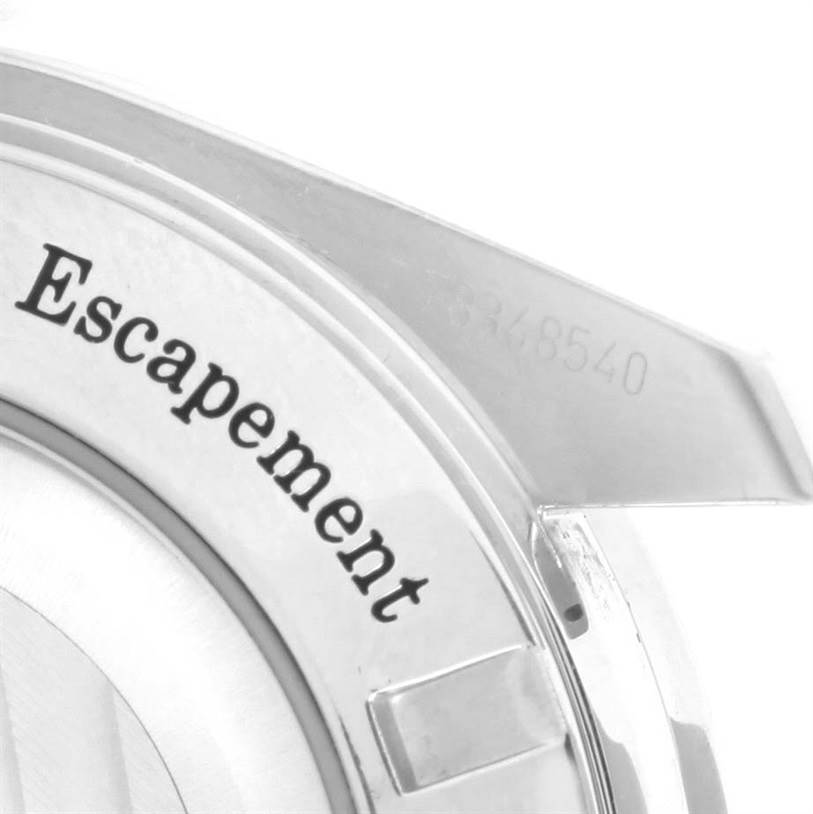 This image shows a close-up view of the case back of an Omega Speedmaster 311.30.44.50.01.002 Men
s Stainless Steel Black Dial 311.30.44.50.01.002 Men
s Stainless Steel Black Dial watch, focusing on the text "Escapement."