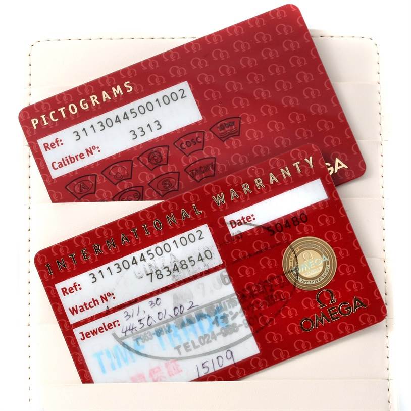 The image shows the Pictograms and International Warranty cards for an Omega Speedmaster 311.30.44.50.01.002 Men
s Stainless Steel Black Dial 311.30.44.50.01.002 Men
s Stainless Steel Black Dial watch.