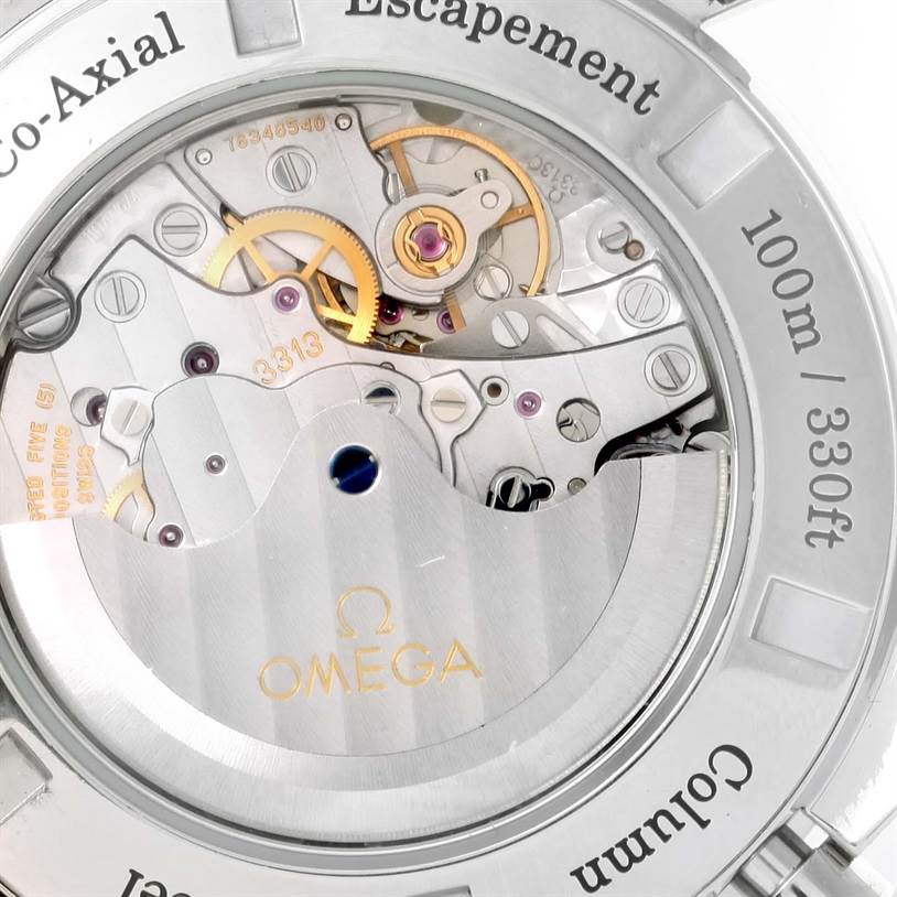 The image shows the movement and inner workings of an Omega Speedmaster 311.30.44.50.01.002 Men
s Stainless Steel Black Dial 311.30.44.50.01.002 Men
s Stainless Steel Black Dial watch from a rear angle through the transparent case back.