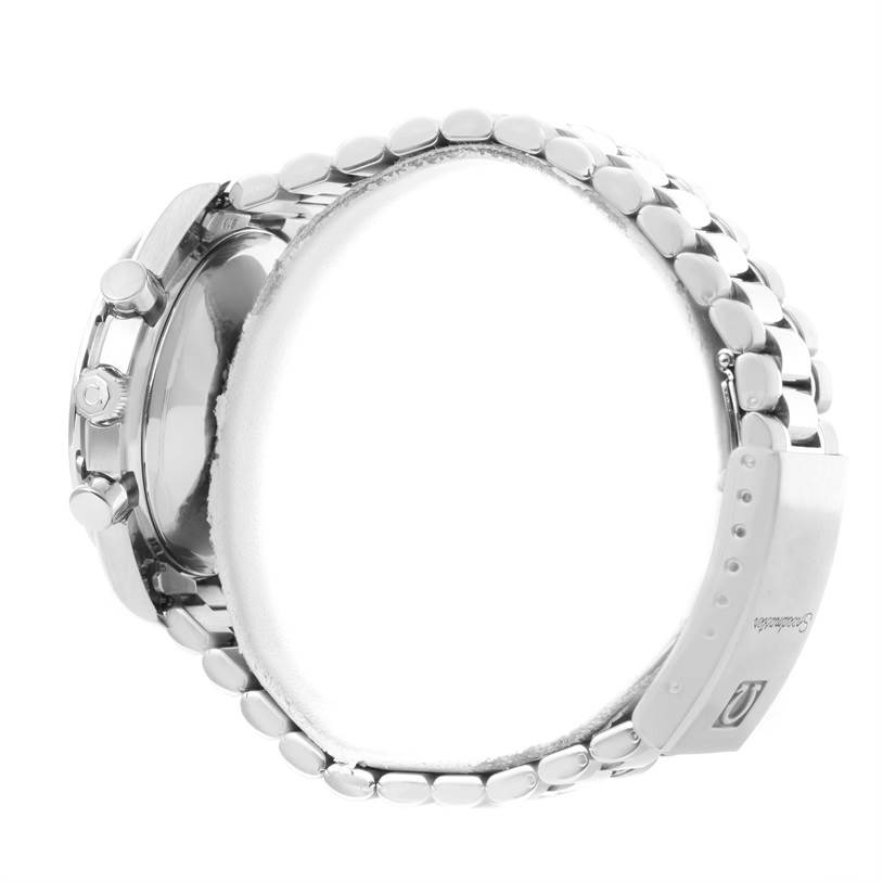 The image shows the side view of an Omega Speedmaster 3521.80.00 Men
s Stainless Steel Blue Dial 3521.80.00 Men
s Stainless Steel Blue Dial watch, focusing on the case, pushers, crown, and part of the metal bracelet.