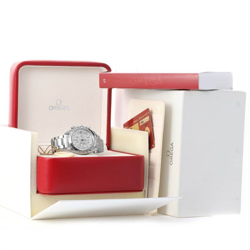 The Omega Speedmaster 3513.30.00 Men's Stainless Steel Silver Dial 3513.30.00 Men's Stainless Steel Silver Dial watch is presented in its open box with accompanying papers and a manual displayed.