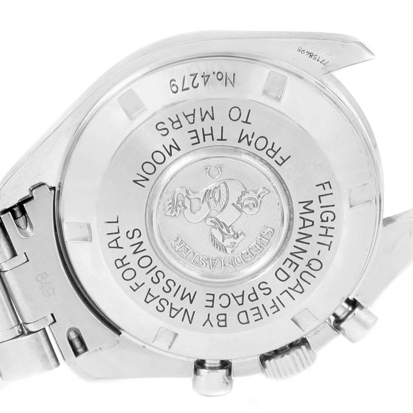 The image shows the back case of the Omega Speedmaster 3577.50.00 Men's Stainless Steel Black Dial 3577.50.00 Men's Stainless Steel Black Dial watch, highlighting engraved text and logos.