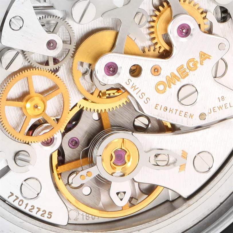 This image shows a close-up view of the Omega Speedmaster 3560.50.00 Men
s Stainless Steel Black Dial 3560.50.00 Men
s Stainless Steel Black Dial watch
s movement, highlighting gears, jewels, and the Omega logo.