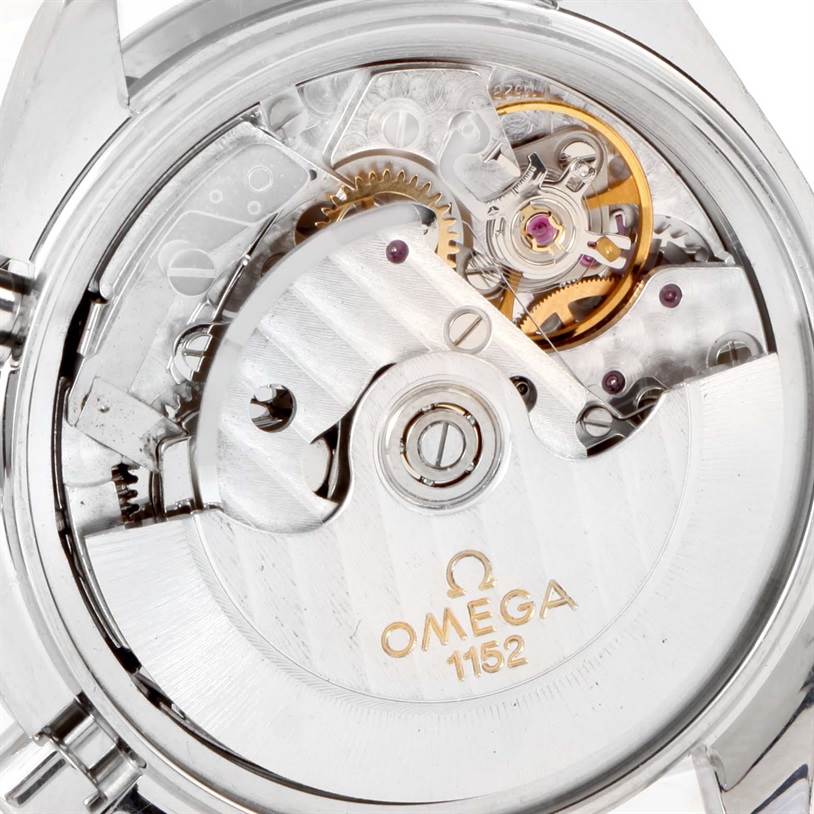 The image shows a close-up of the Omega Speedmaster 3513.30.00 Men
s Stainless Steel Silver Dial 3513.30.00 Men
s Stainless Steel Silver Dial watch
s internal mechanical movement from the rear view.