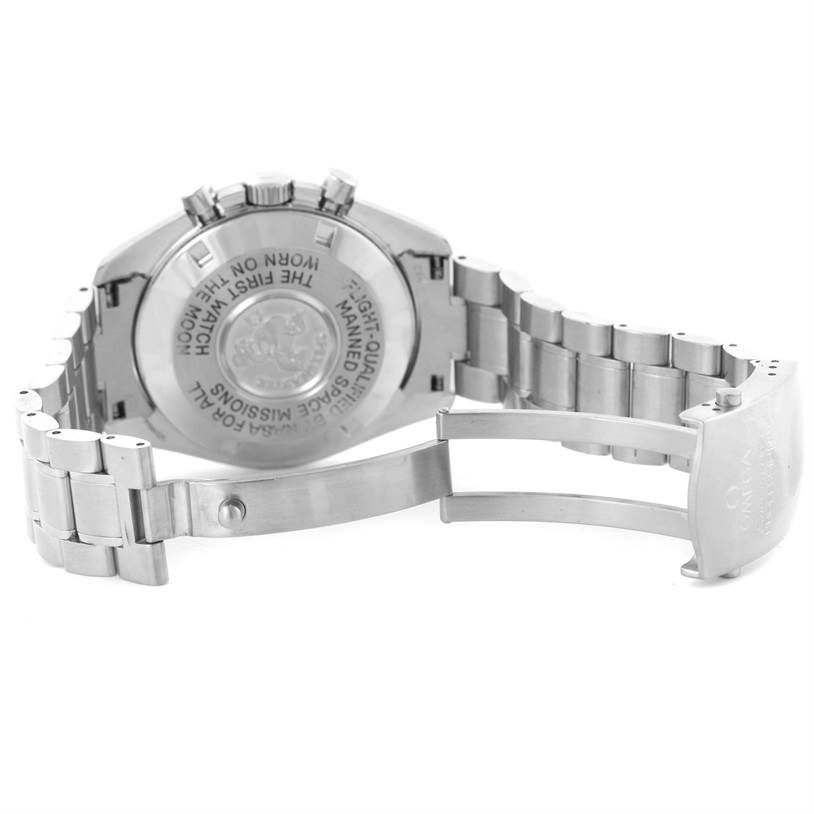 The image shows the back case and bracelet of the Omega Speedmaster 3570.50.00 Men
s Stainless Steel Black Dial 3570.50.00 Men
s Stainless Steel Black Dial watch at an angle that highlights the clasp and engravings.