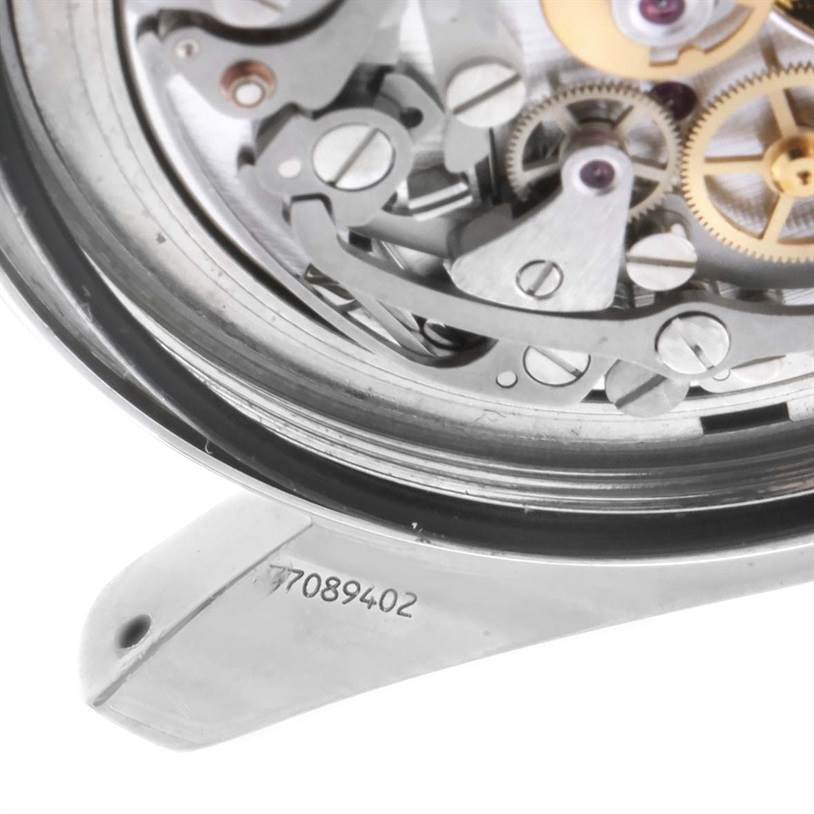 This image shows a close-up of the movement and inner mechanisms of an Omega Speedmaster 3570.50.00 Men
s Stainless Steel Black Dial 3570.50.00 Men
s Stainless Steel Black Dial watch, along with a visible serial number.