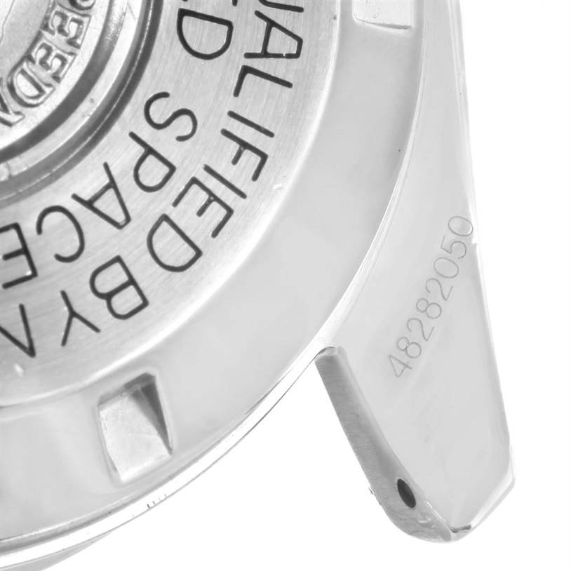 The image shows a close-up of the case back and a lug of an Omega Speedmaster Men
s Stainless Steel Black Dial Men
s Stainless Steel Black Dial watch.