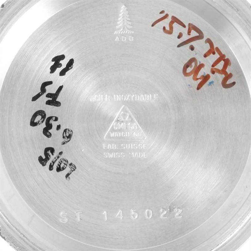 The image shows the inside case back of an Omega Speedmaster Men
s Stainless Steel Black Dial Men
s Stainless Steel Black Dial watch, displaying model information and various inscriptions.