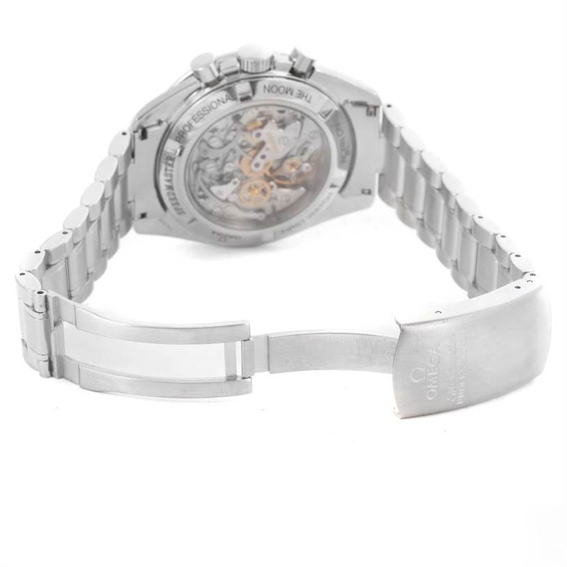 The image shows the back of an Omega Speedmaster 3572.50.00 Men
s Stainless Steel Black Dial 3572.50.00 Men
s Stainless Steel Black Dial watch, focusing on its open clasp and visible movement in the caseback.