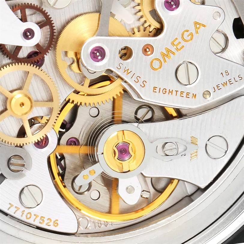 This close-up angle shows the intricate internal mechanics and gears of the Omega Speedmaster 3570.50.00 Men
s Stainless Steel Black Dial 3570.50.00 Men
s Stainless Steel Black Dial watch, showcasing the brand and model details.